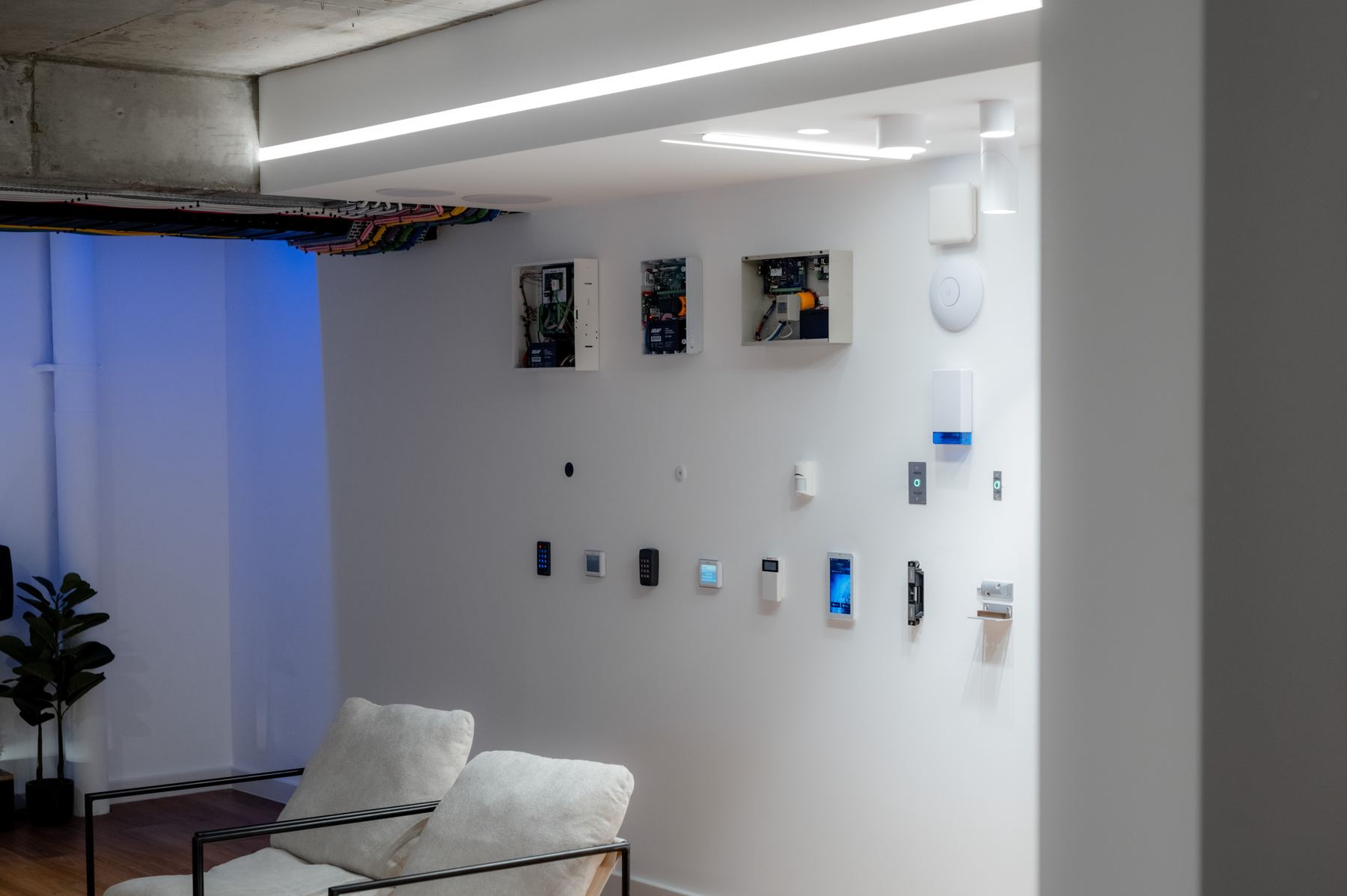 Intercom and access hardware on the showroom wall